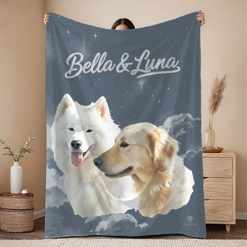 The same dogs as a watercolor portrait on a navy cloud-print blanket, personalized with the names Bella and Luna